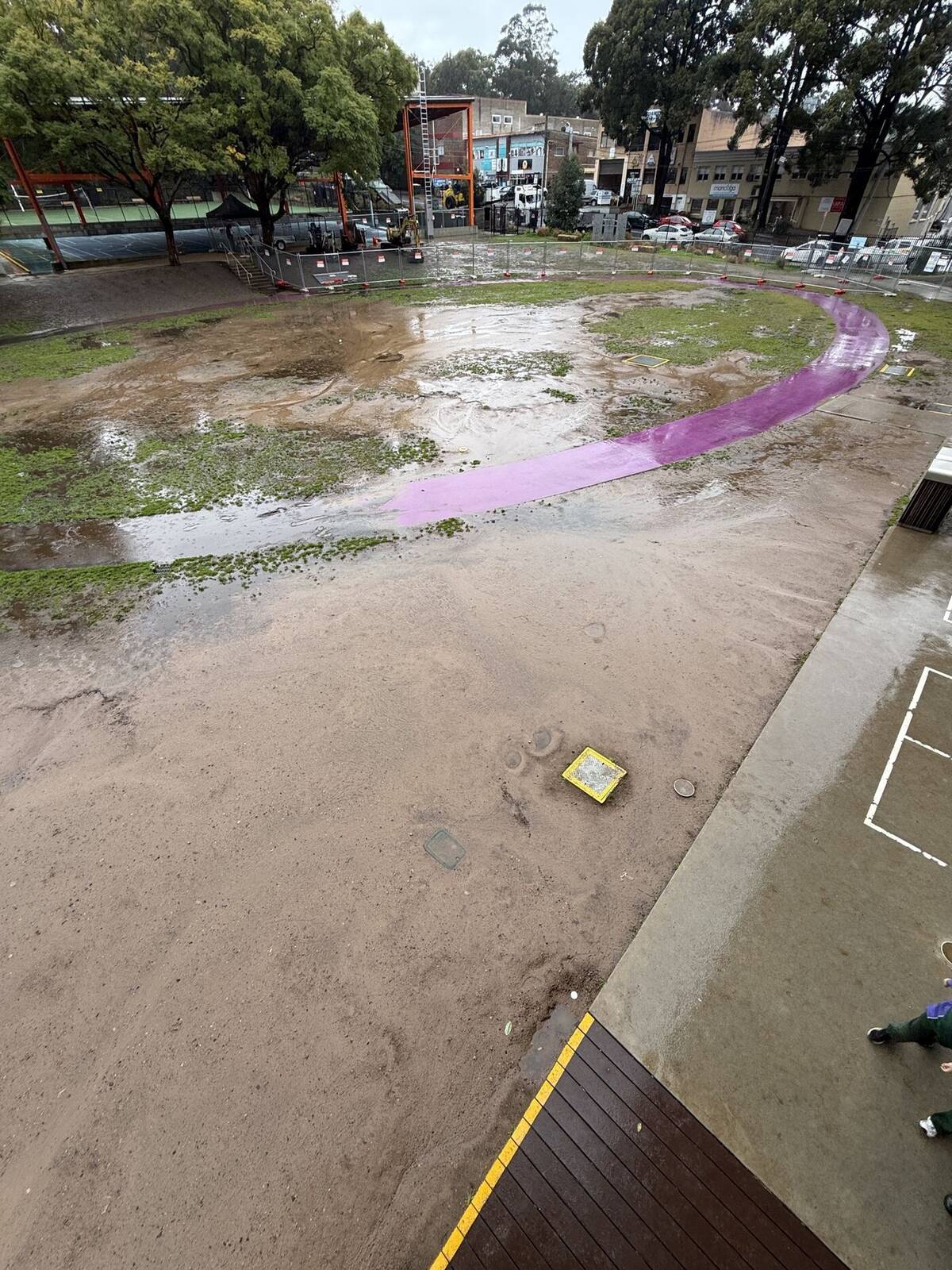 An oval that finally drains — Before — waterlogged