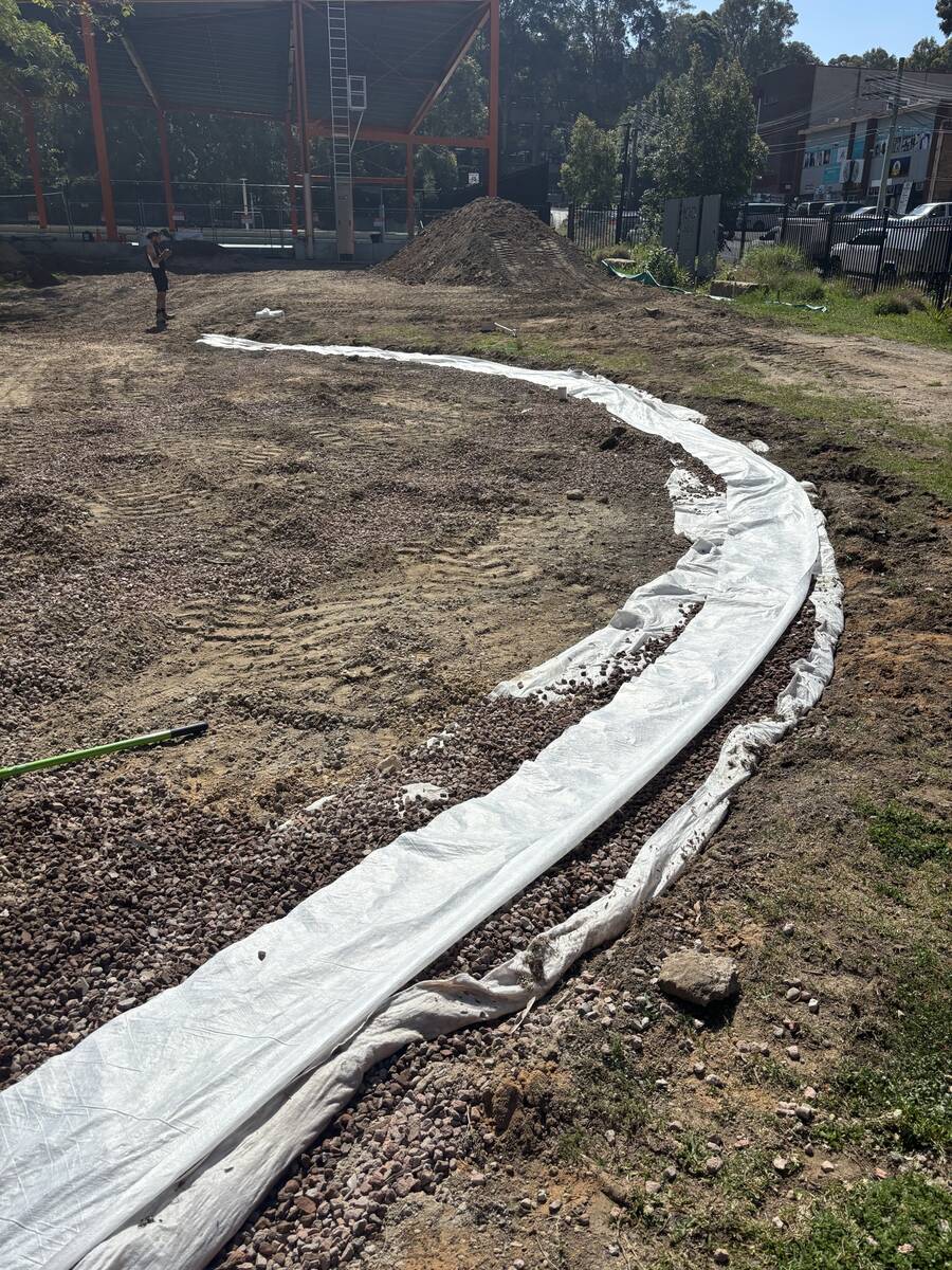 An oval that finally drains — During — subsoil drainage